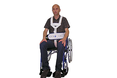 Bevægelseshæmmende positionsholdere til siddende patienter